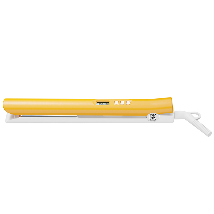GK Hair D600+ Titanium Flat Iron closed flat in profile, yellow shell on a white base, display reading 230°C