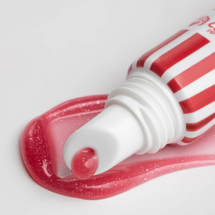 Red and white striped tube with pink lip gloss Lipss Poprcorn on a white background
