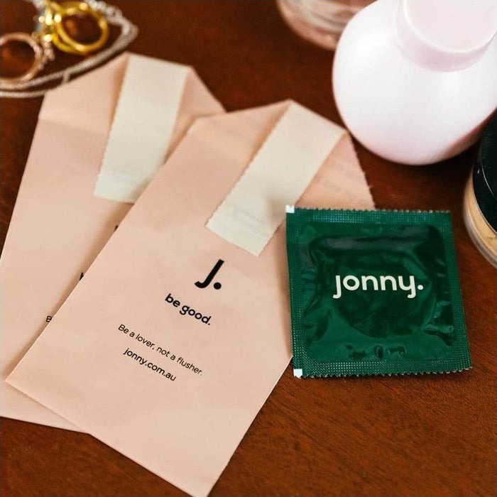 Jonny Lovers Dozen 13 Pack of vegan condoms with disposal bags.