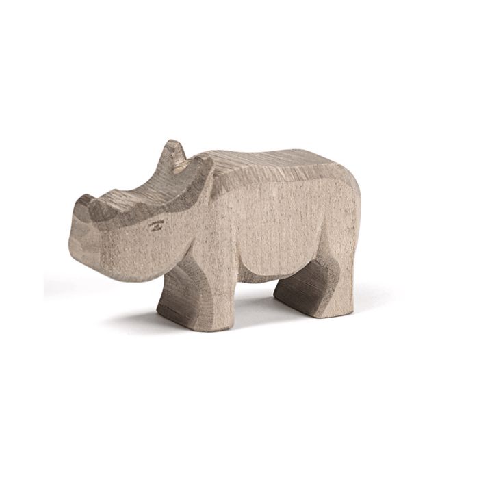 Wooden toy rhino on a white background