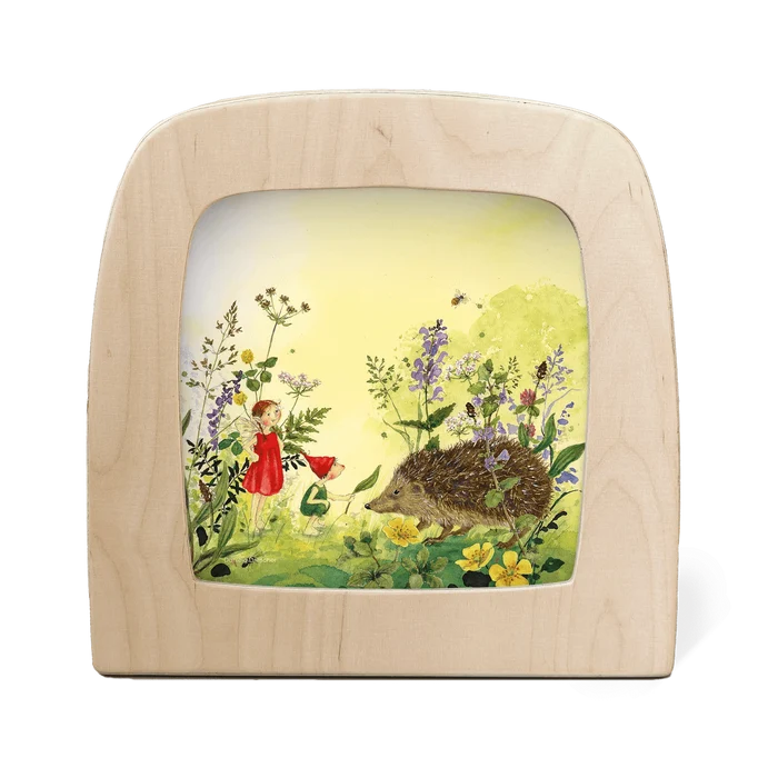 Wooden frame with a fairy and hedgehog illustration on a white background