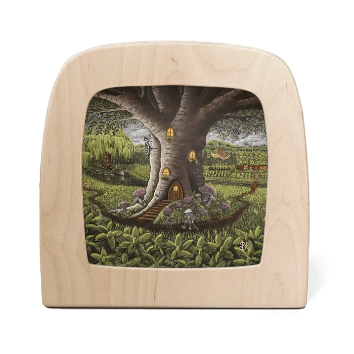 A gnome stands outside of a large tree that has been converted into a home with illuminated lights, in the middle of a field