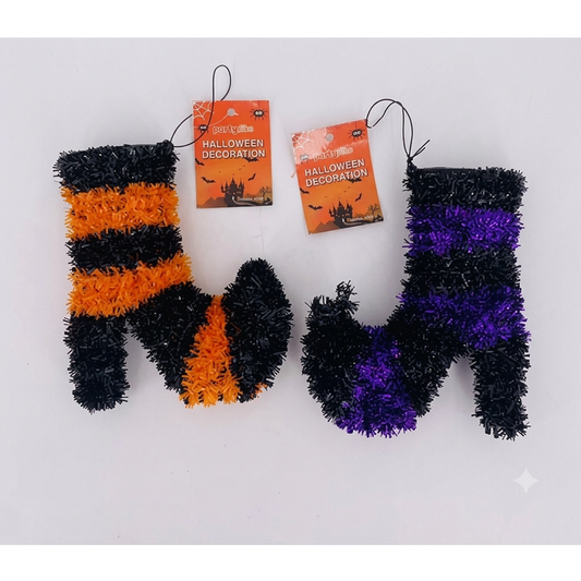Two fuzzy Halloween stockings shaped like letters M and N, with one stocking in black and orange stripes and the other in black and purple stripes, both with orange 'Halloween Decoration' tags on a white background.