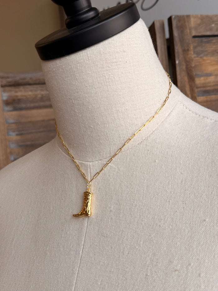 Gold plated boot pendant necklace with link chain, close view on mannequin