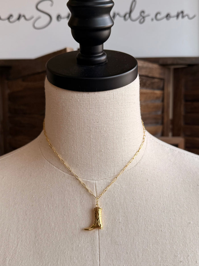Gold plated boot charm necklace, gold chain and boot pendant on a mannequin