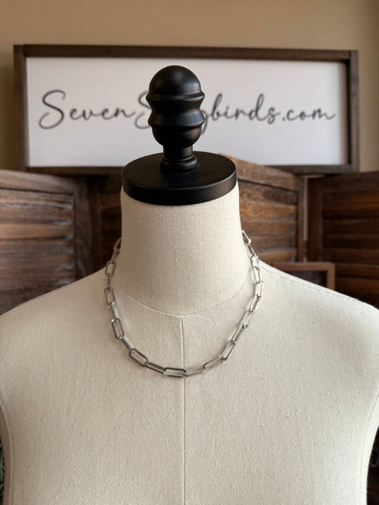 Silver stainless steel thick chain necklace on a mannequin