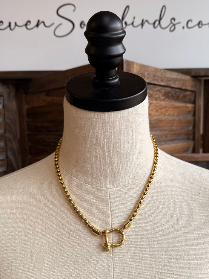Gold box chain necklace with D-ring pendant, front view