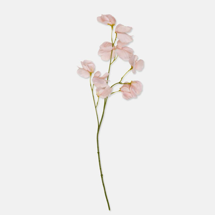 Pink artificial flower branch on a white background