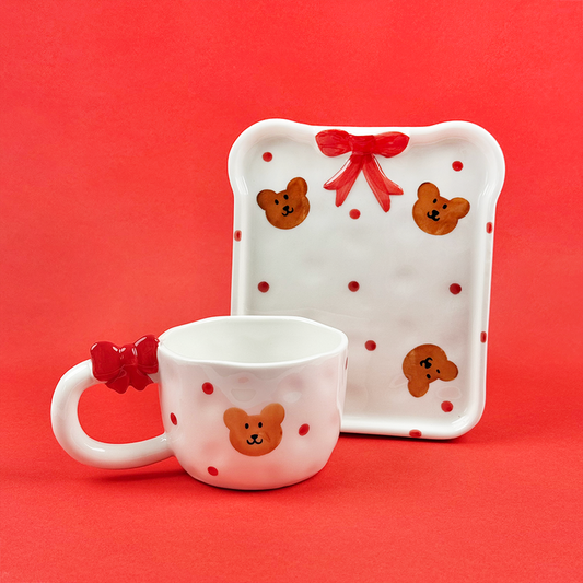 Beary Cute mug and toast plate set with bear faces, bows, and a red polka-dot background.