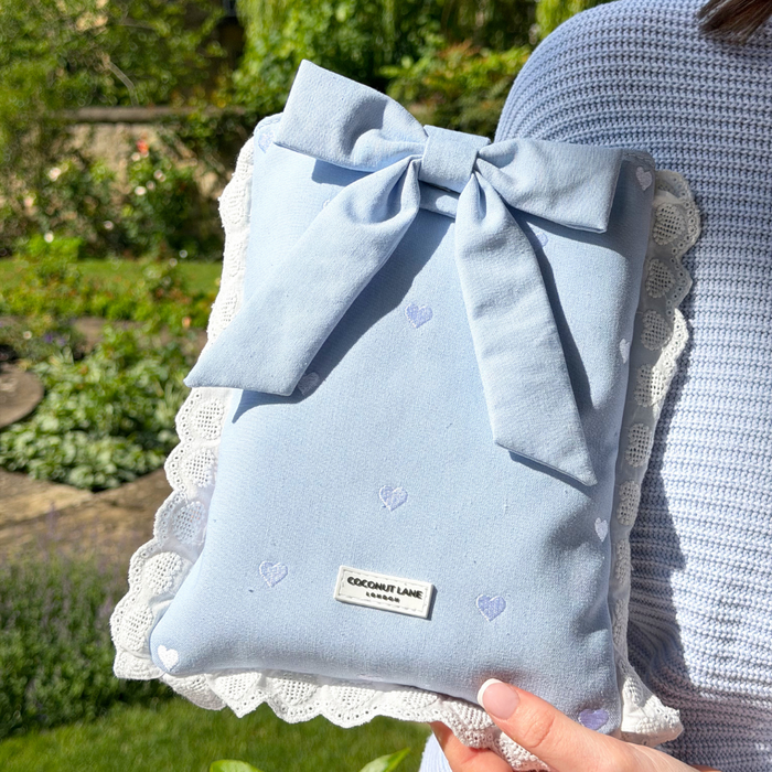 Close up image of Blue Hearts Book Sleeve in a garden