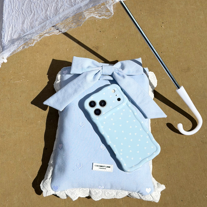 Flatlay image of Blue Hearts Book Sleeve and matching Phone Case