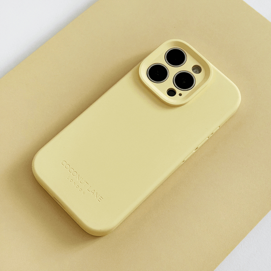 Yellow Phone Case with 'Coconut Lane' branding on a pink background.