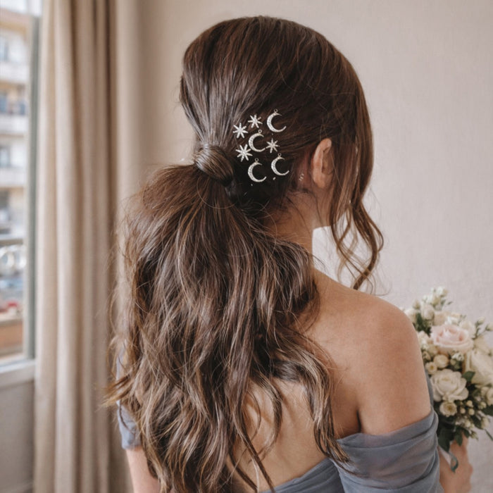 Star moon hair accessories pinned in braided wedding updo - lightweight celestial hair charms
