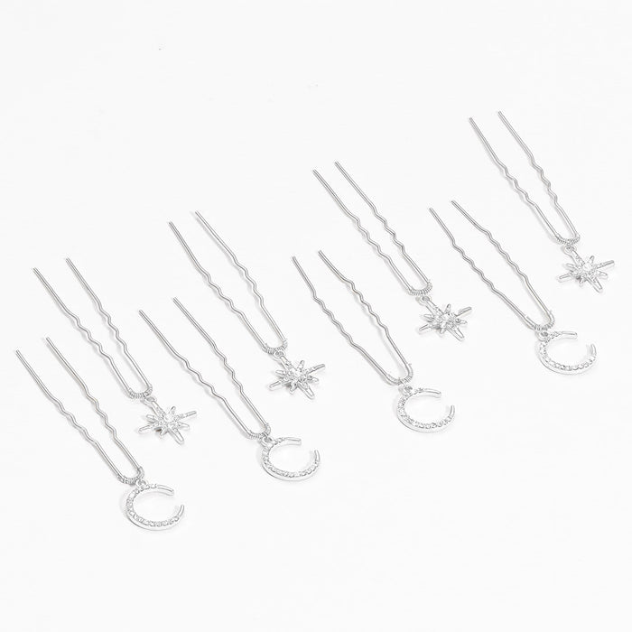 Delicate gold star moon pins scattered through soft updo hairstyle for sufi night celebration