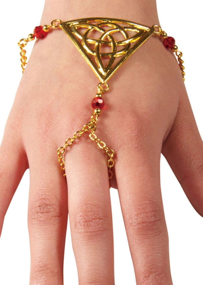 Gold Celtic triquetra triangle hand chain finger bracelet with red bead accents worn on hand