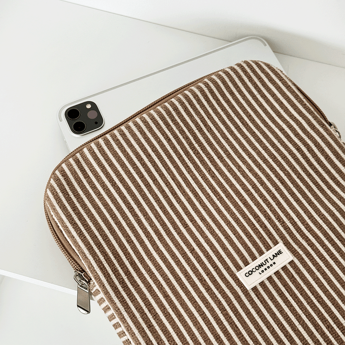 Chestnut striped padded iPad sleeve by Coconut Lane holding a silver tablet on a white surface.