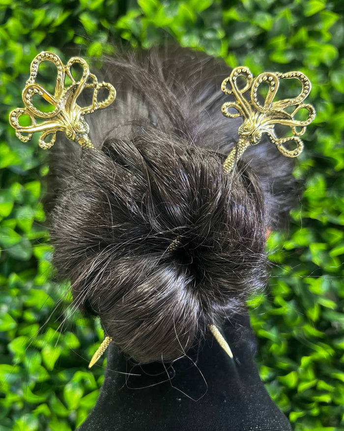 Demo showing silver Cthulhu octopus hair stick securing a twisted bun hairstyle, highlighting the fantasy-inspired metal design and secure hold for buns and updos.