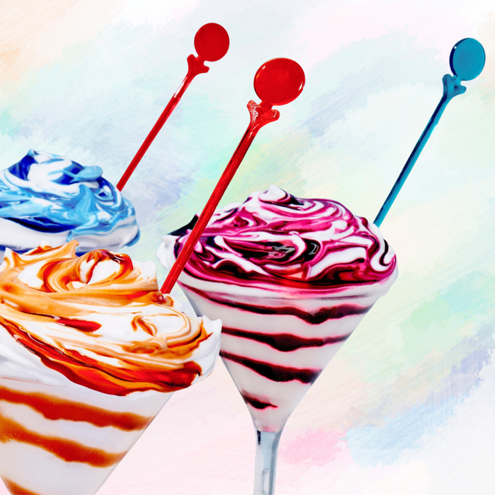 Colorful ice cream milk_shake  with spoons on a multicolored background