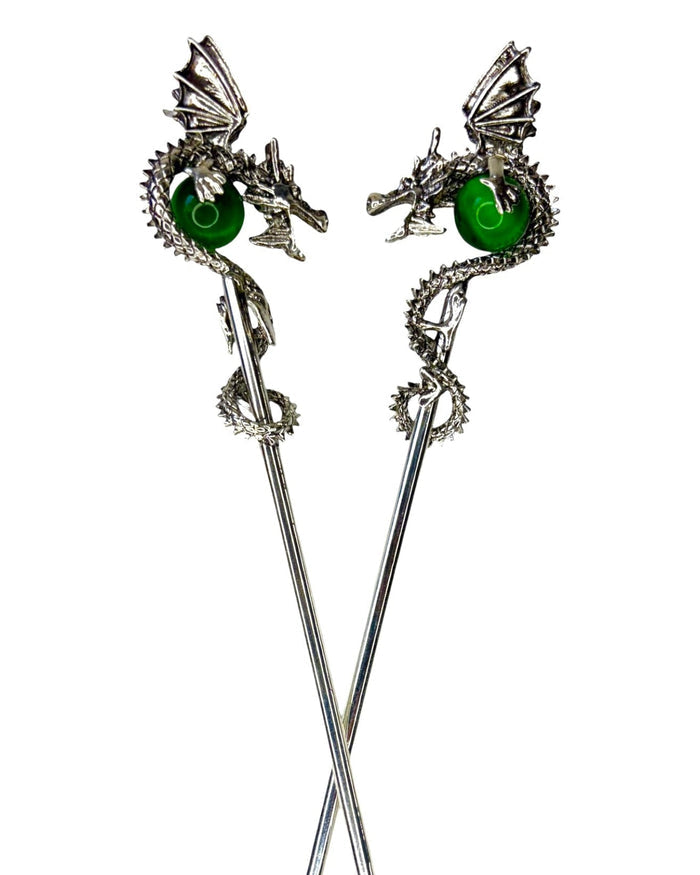 Silver Dragon Hair Sticks with 3D dragons holding green crystal spheres, front view on white background.