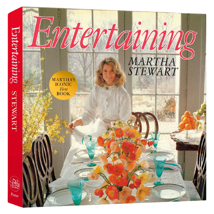 Book cover of 'Entertaining' by Martha Stewart with a woman setting a table.
