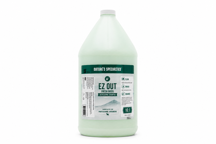 A bottle of Nature's Specialties Ez Out Fresh Oasis Deshedding Shampoo on a solid white background.