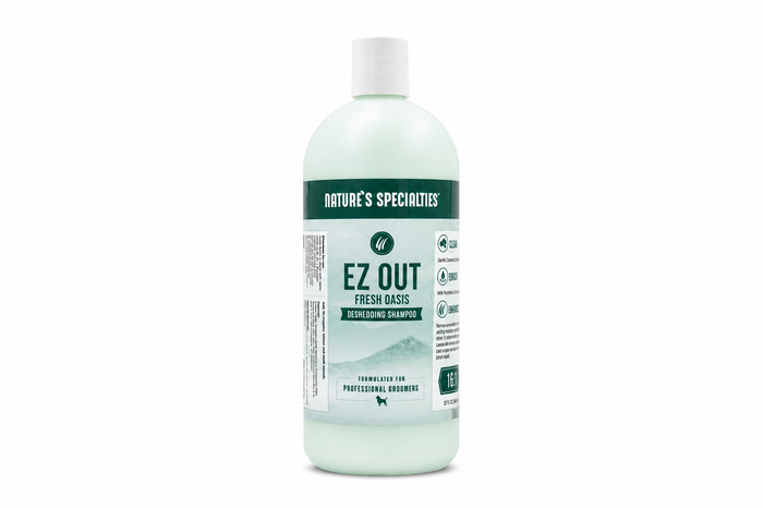 A bottle of Nature's Specialties Ez Out Fresh Oasis Deshedding Shampoo on a solid white background.