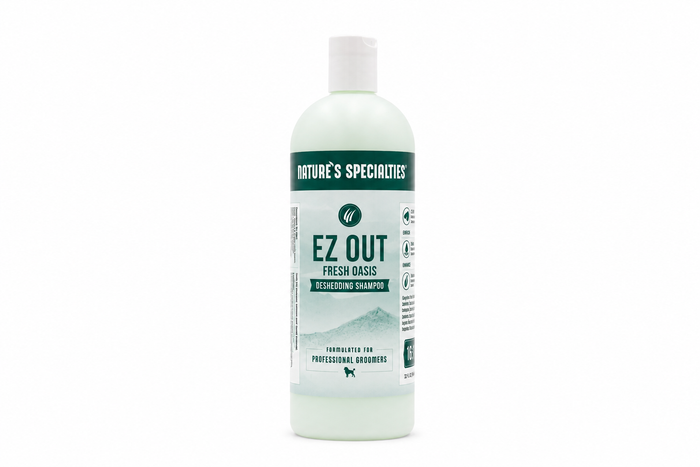 A bottle of Nature's Specialties Ez Out Fresh Oasis Deshedding Shampoo on a solid white background.