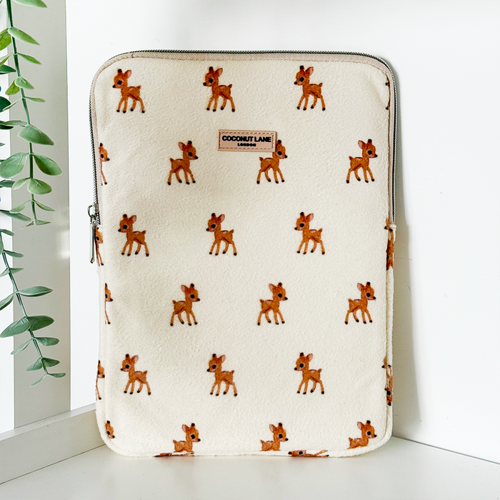 Brown iPad sleeve with a deer print, zipper closure, and a small fabric Coconut Lane label.