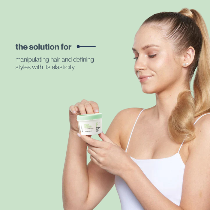 Woman holding a container of milk_shake freehand paste