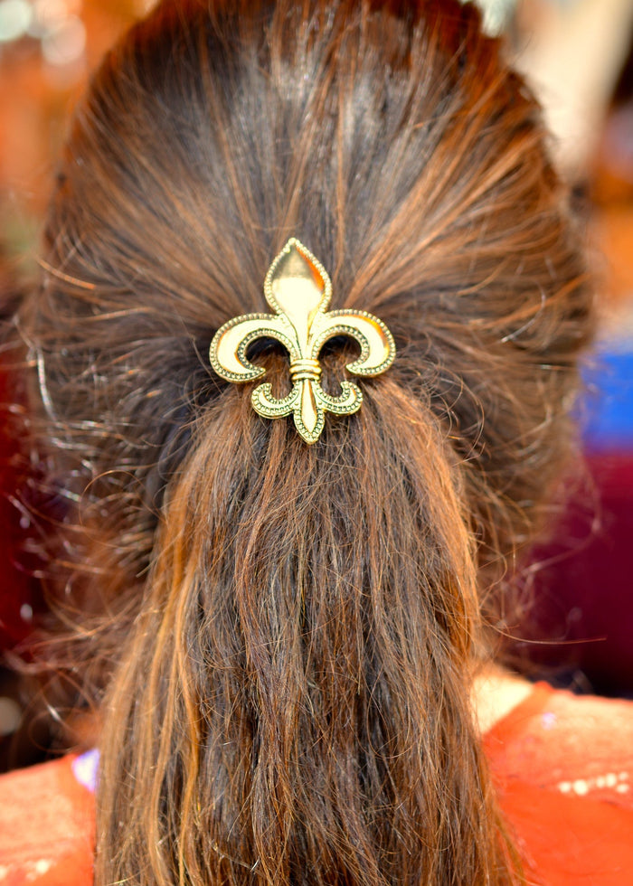Model wearing Gold Fleur-de-lis Hair Hook - Elegant Ponytail Holder