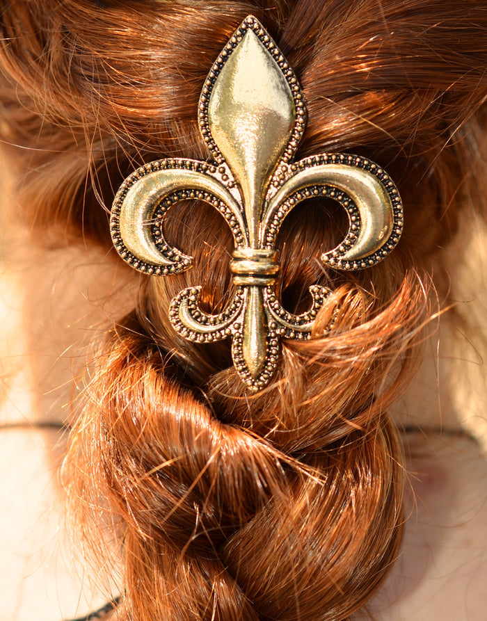 Model wearing Gold Fleur-de-lis Hair Hook - Elegant Ponytail Holder