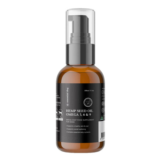 Bottle of hemp seed oil for dogs on a white background.