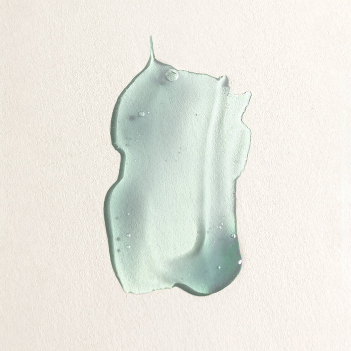 Swatch of blue gel-like hyaluronic marine serum on a neutral background.