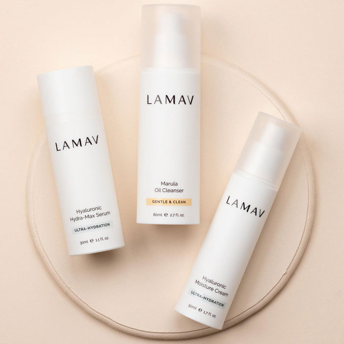 Three LAMAV skincare products on a beige background