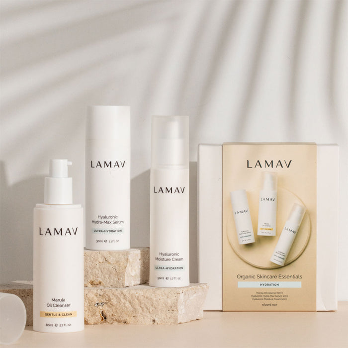LAMAV skincare products on a neutral background, with stone slabs and packaging in frame.
