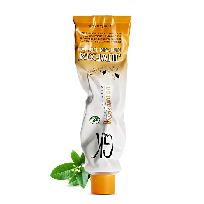 GK Hair Juvexin Cream Color permanent color tube, 100 ml, on its orange cap with green leaves and white blossom at its base