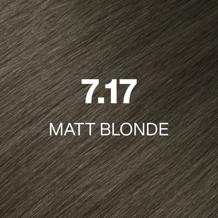 GK Hair Juvexin Cream Color 7.17 Matt Blonde hair color swatch, olive-toned gray-brown strands labeled in white
