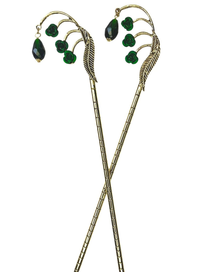 Gold Feather Hair Sticks with green crystal drops and feather design, pair shown front view on a white background.