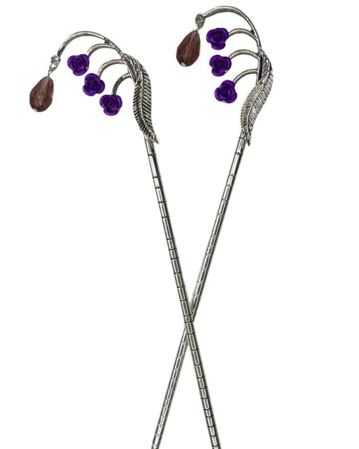 ilver Feather Hair Sticks featuring purple flower accents and brown crystal drops, pair shown front view on a white background.