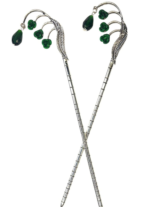 Silver Feather Hair Sticks featuring a feather design with green crystal drops, pair shown front view on a white background.