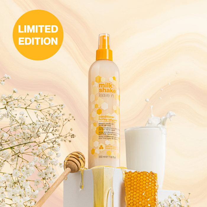 milk_shake honey infused leave in hair care product with honey and flowers on a soft background