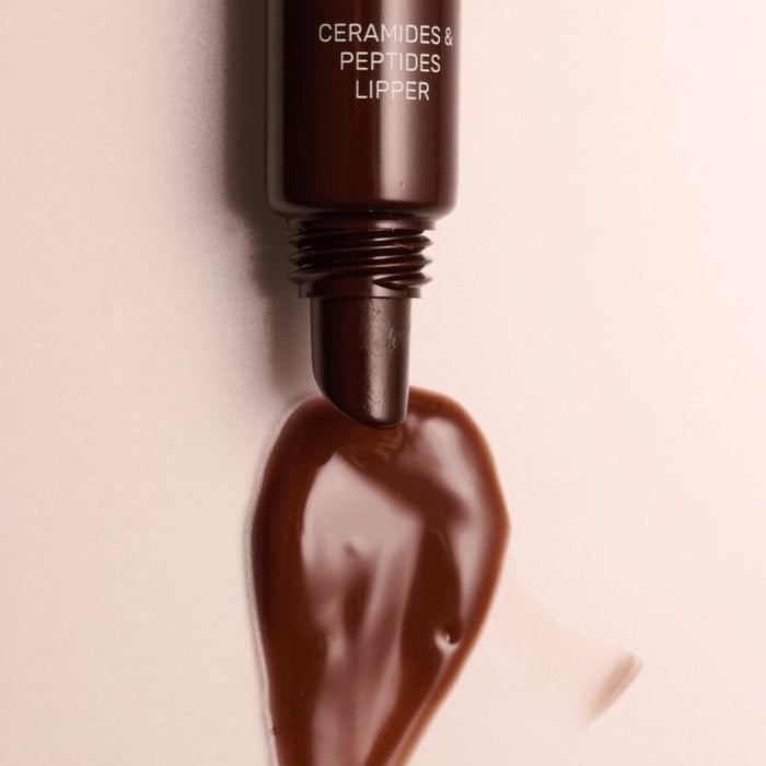 Lip gloss Lipss Coffee a beige background