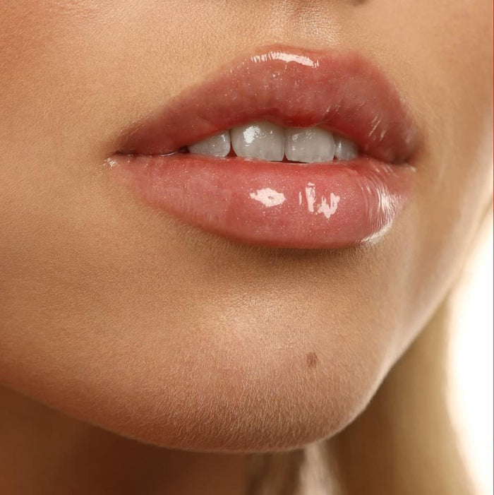 Close-up of glossy lip gloss Lipss Gelato Italiano with a neutral background