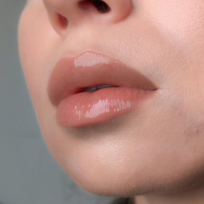 Close-up of a person's lips with Lipss lip gloss Latte