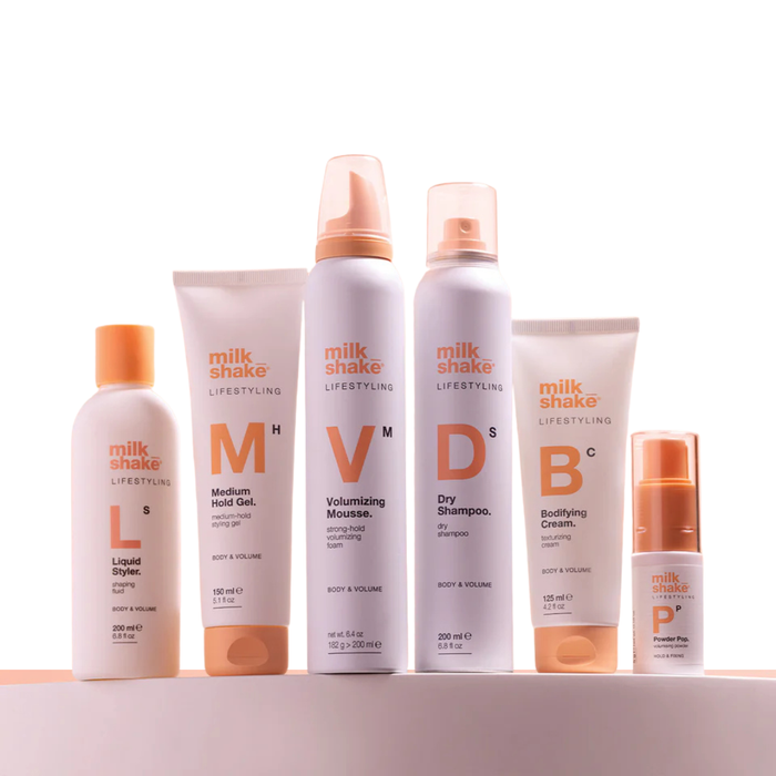 milk_shake  hair care product lineup on a white background