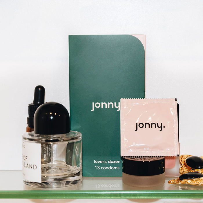 Jonny Lovers Dozen 13 Pack of vegan condoms with other beauty and personal care products.