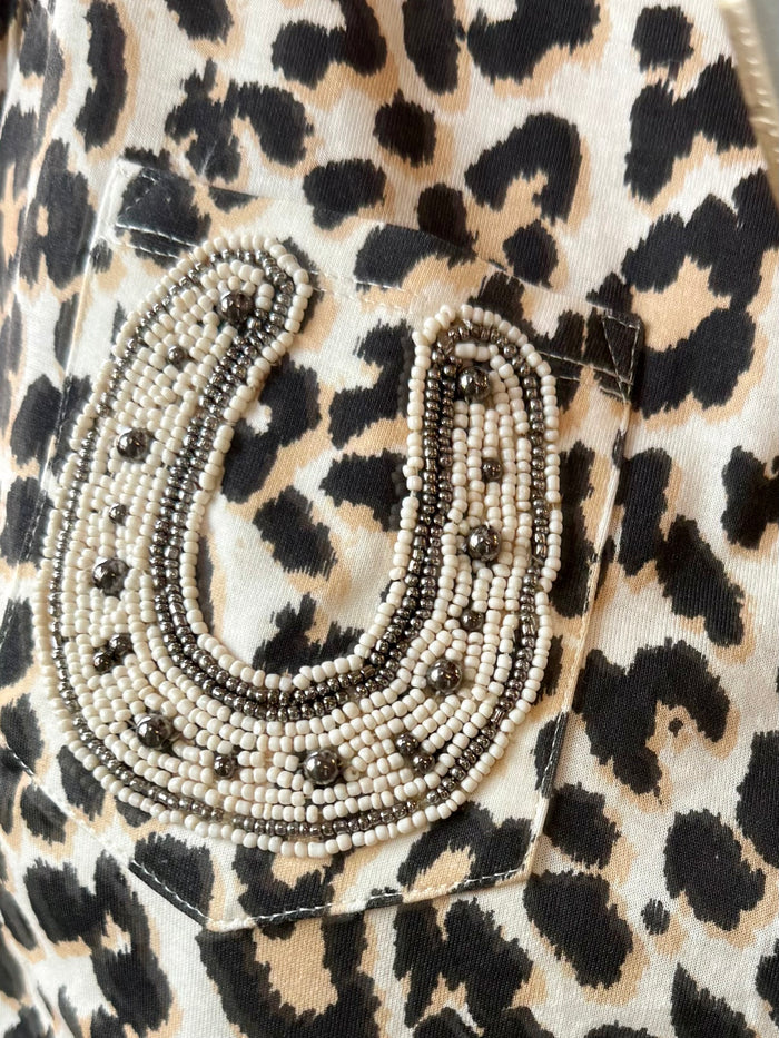 Beaded horseshoe applique on leopard print T-shirt front