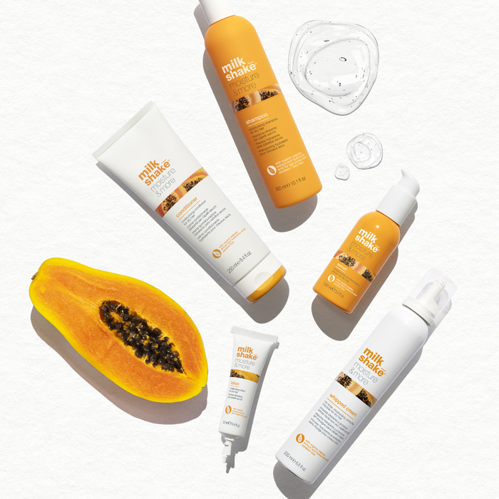 milk_shake moisture & more range with a papaya on a white background