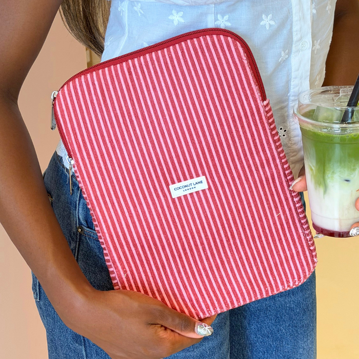 Girl holding matcha with her Mulberry Stripes iPad Sleeve