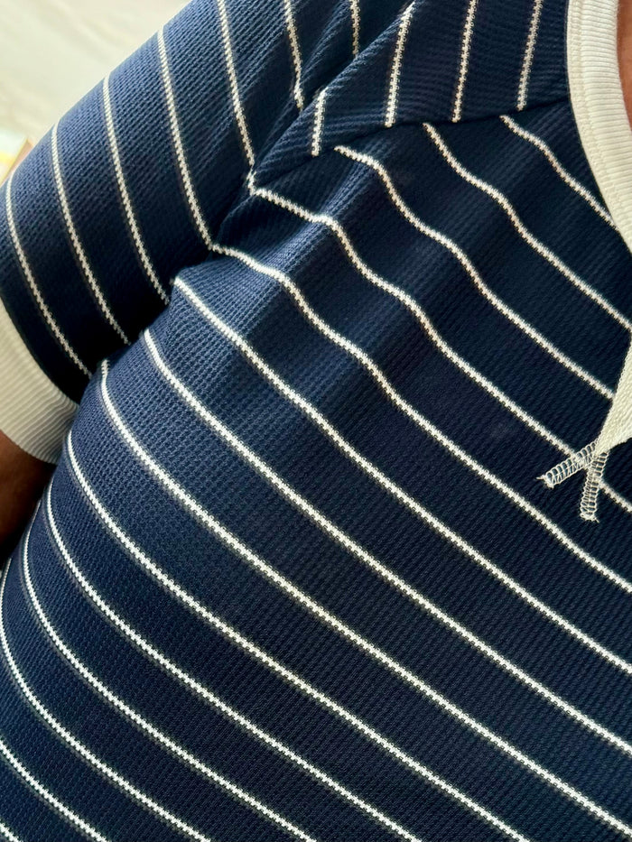 Navy striped T-shirt knit close-up, white thin horizontal stripes